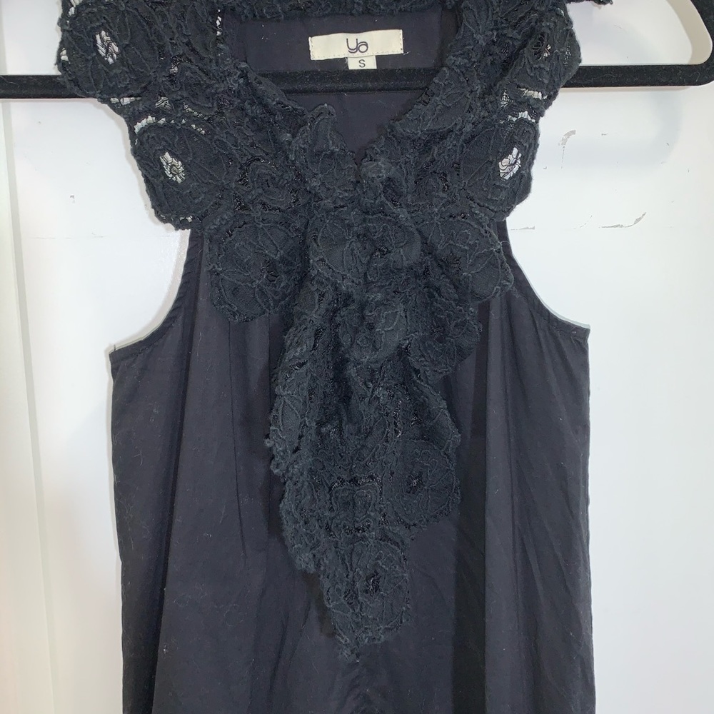Women’s black dress with neck and hem detail small